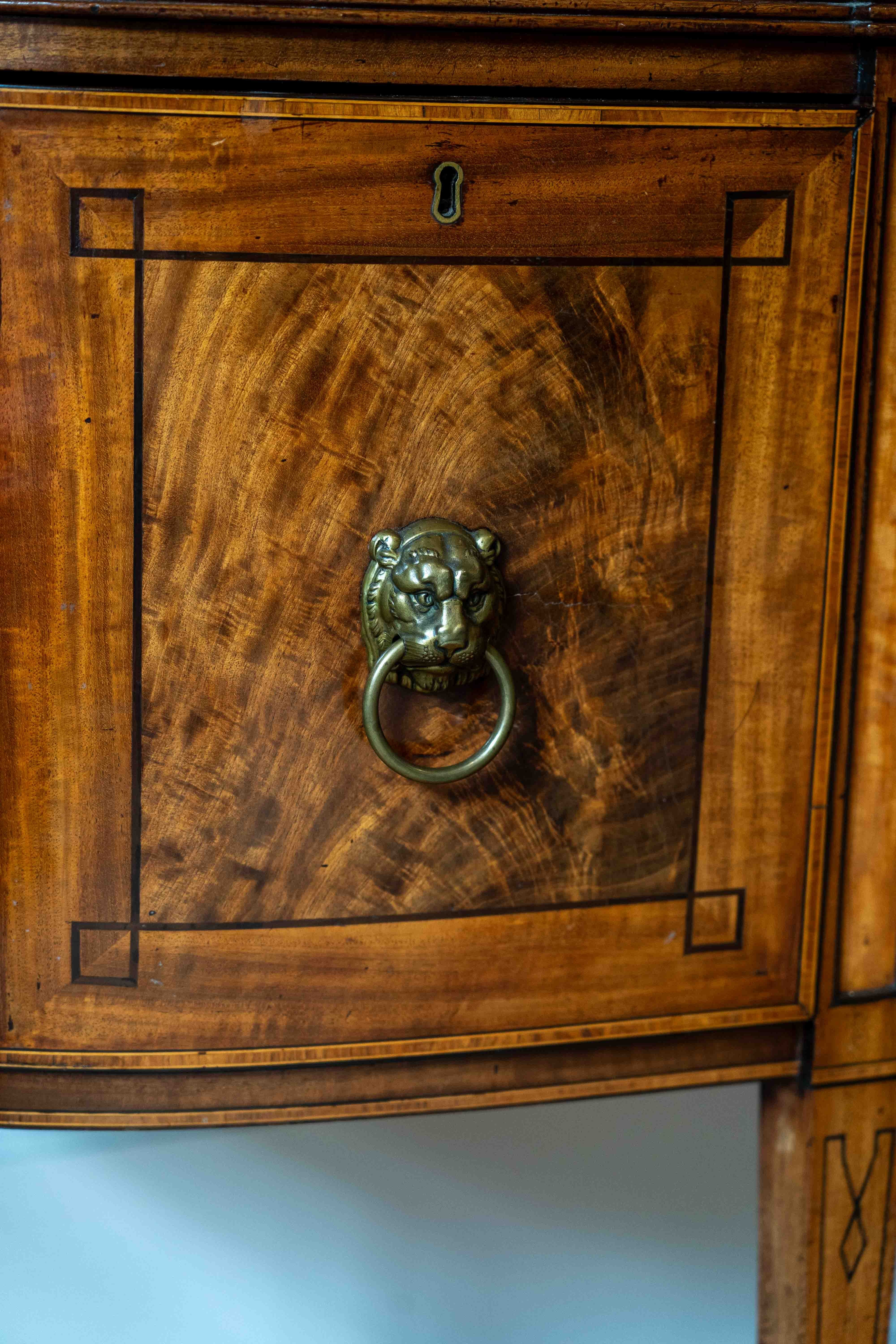 A Regency mahogany bowfront sideboard, width 182cm, depth 74cm, height 94cm. Condition - fair